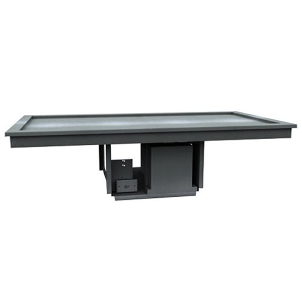 A black rectangular table with a Delfield frost top in the middle.