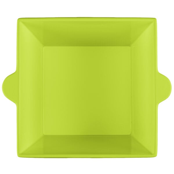 A lime green square bowl with handles.