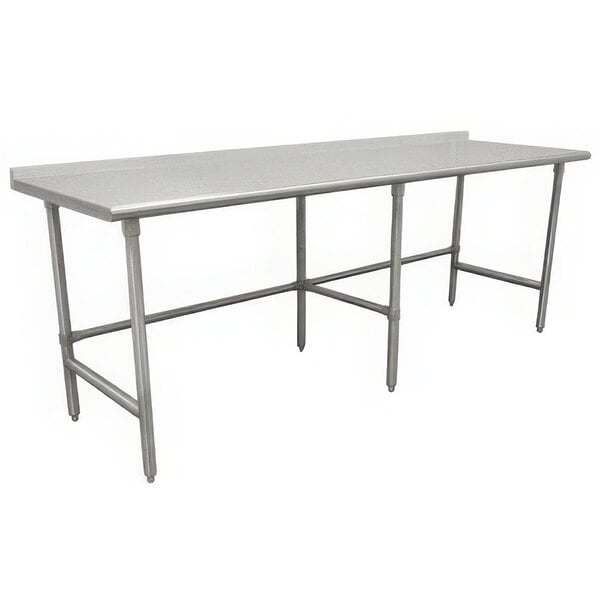 A stainless steel Advance Tabco commercial work table with a backsplash and open base.