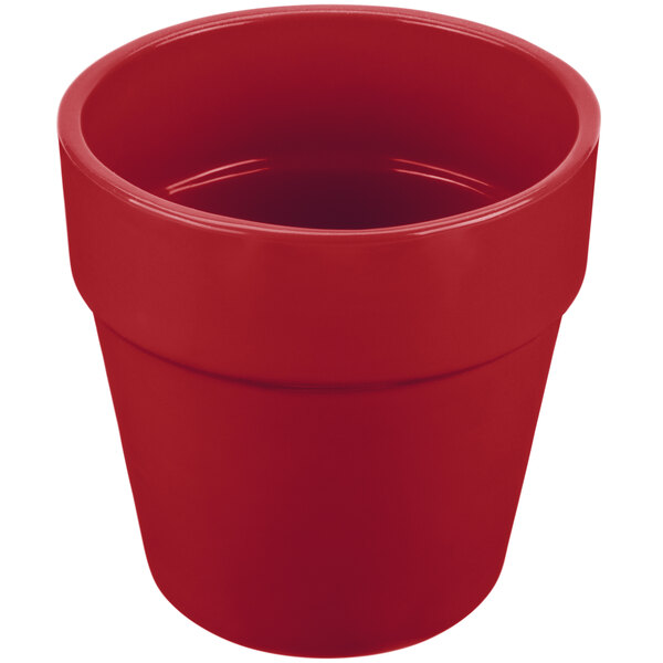 A red cast aluminum round condiment bowl with a lid.