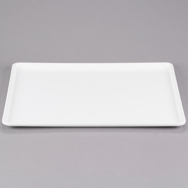 a white rectangular tray on a gray surface