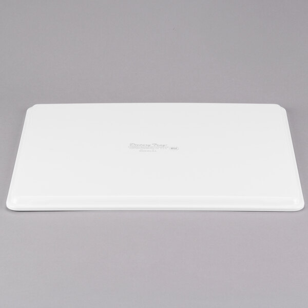 A white rectangular Cambro dietary tray with a lid.