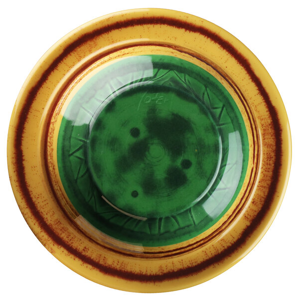 A yellow and green melamine bowl with a circular pattern in green and black.