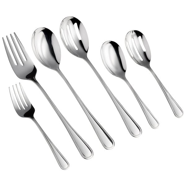 An Acopa Edgeworth slotted spoon next to a fork and spoon.