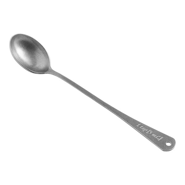 A Barfly stainless steel measuring spoon.
