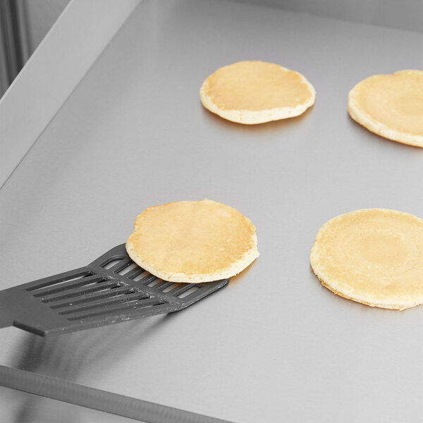 A pancake cooking on a Cooking Performance Group gas griddle