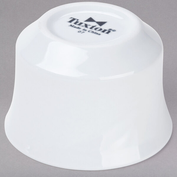 A Tuxton bright white china bouillon cup with an embossed rim.