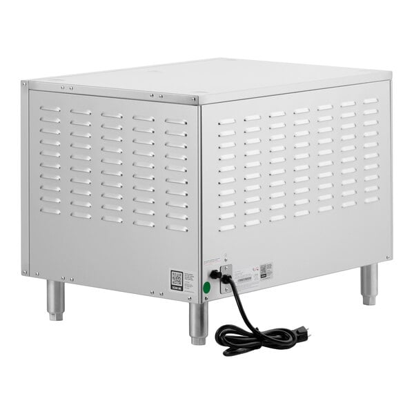 A stainless steel double deck countertop pizza and bakery oven with ventilation slots and an attached power cord.