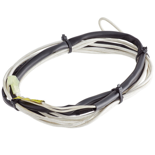 A white and black wire with a white connector on an Avantco Drain Line Heater.