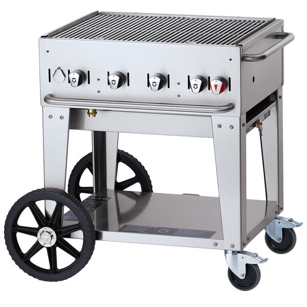 A Crown Verity natural gas grill on a cart with wheels and a lid.