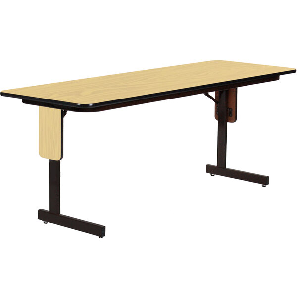 A Correll rectangular seminar table with a black frame.