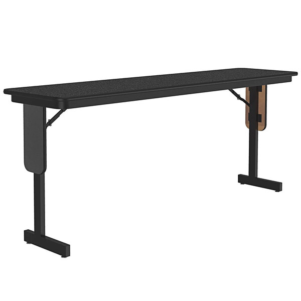 A black rectangular Correll seminar table with black panel legs.