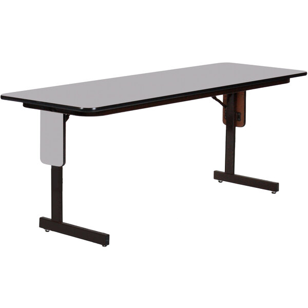 A rectangular table with a gray granite finish top and black panel legs.