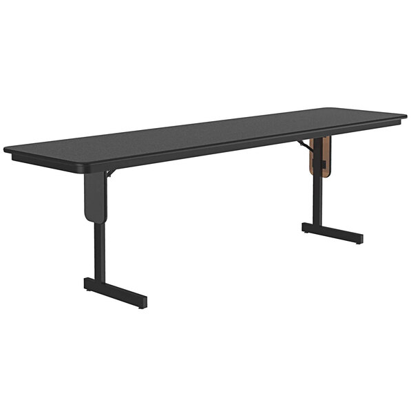 A black rectangular Correll seminar table with panel legs.