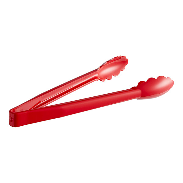 Carlisle red plastic utility tongs with long handles.