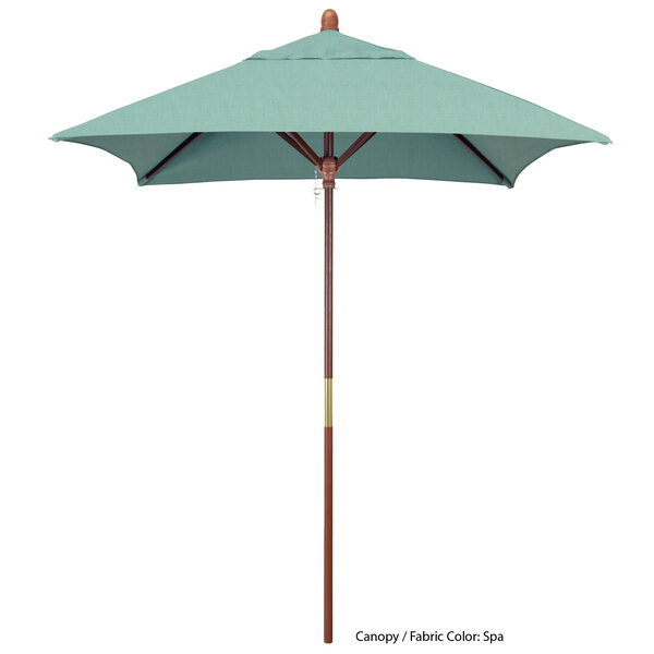 A close-up of a blue California Umbrella with a hardwood pole and Sunbrella canopy.