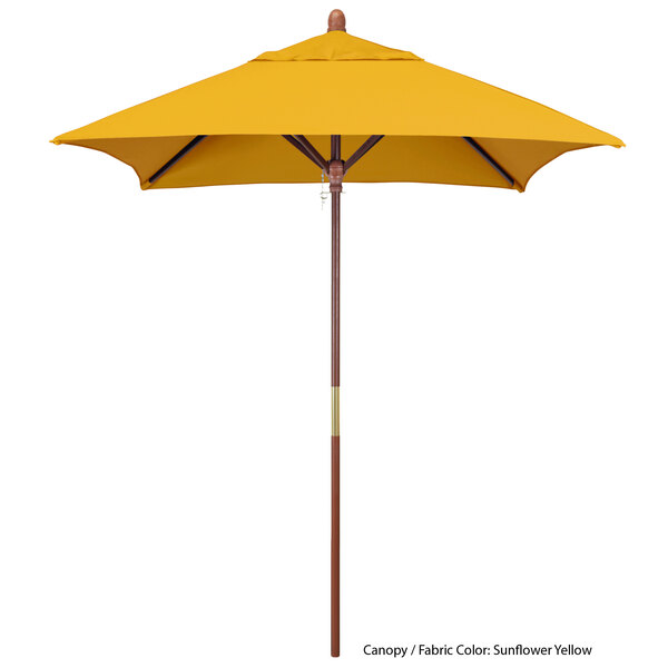 A yellow umbrella with a wooden pole.