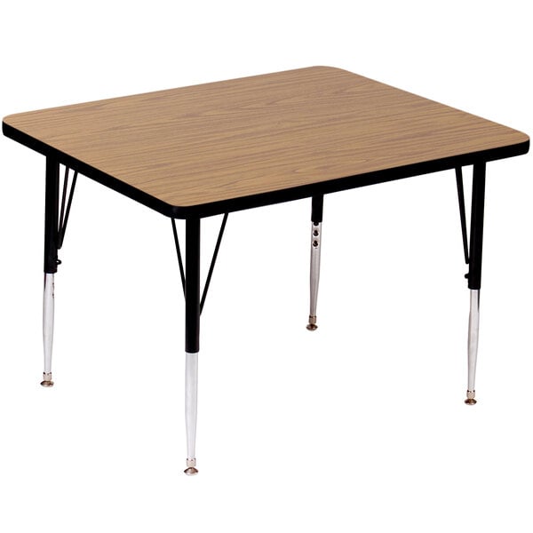 A rectangular Correll activity table with medium oak legs and a high pressure top on it.