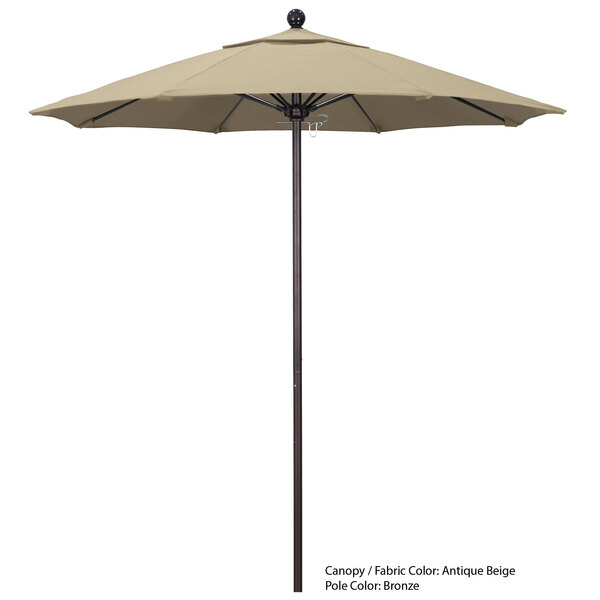 A California Umbrella ALTO Sunbrella 1A canopy on a large round umbrella with a wooden pole.