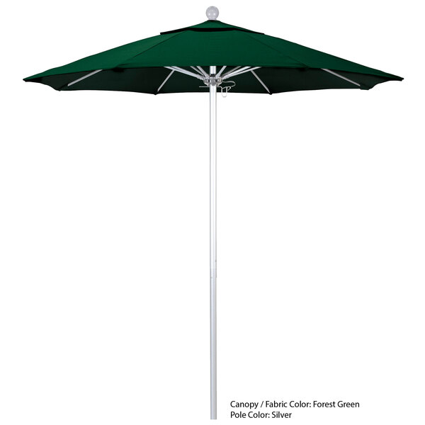 A green California Umbrella with a Sunbrella canopy on a white pole.