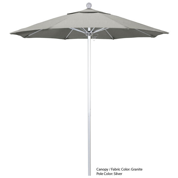 A white California Umbrella on a gray pole.