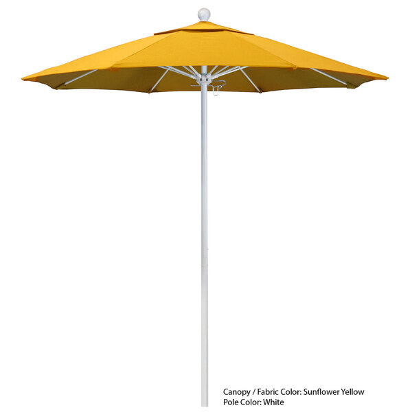 A yellow California Umbrella on a white pole.