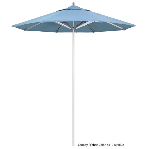 A California Umbrella with a blue Sunbrella canopy.