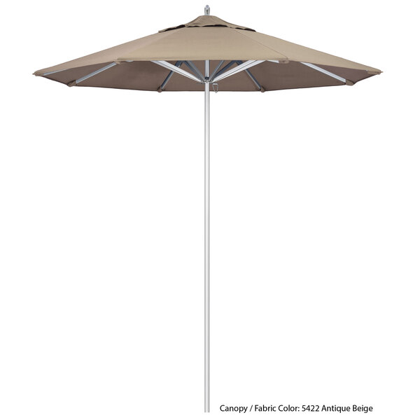 A California Umbrella Rodeo Sunbrella canopy in beige with a white pole.