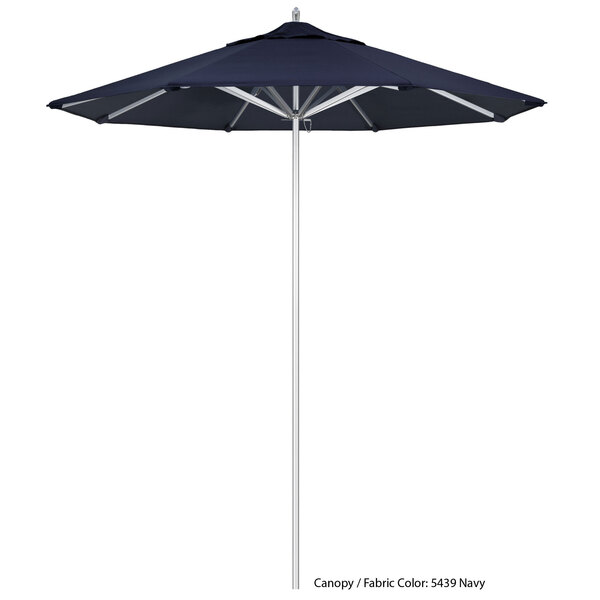 A close-up of a black California Umbrella with a blue Sunbrella canopy.