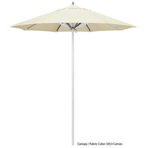 A close up of a white California Umbrella with a metal pole.