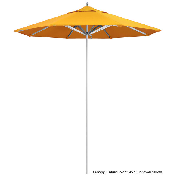 A yellow California Umbrella with Sunbrella canopy.