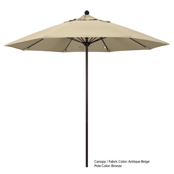 A California Umbrella Sunbrella canopy in beige on a black pole.