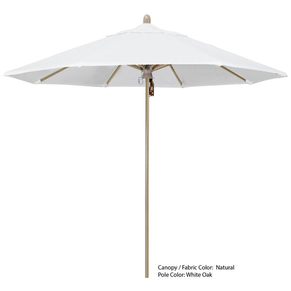 A white California Umbrella with a wooden pole.