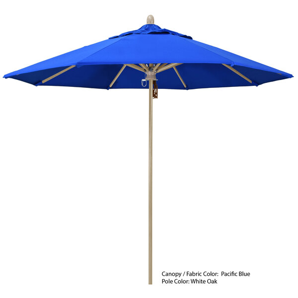 A blue umbrella with a wooden pole and Sunbrella canopy.