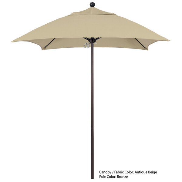 a tan umbrella on a white background