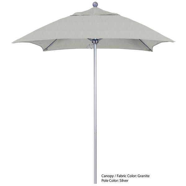 A California Umbrella ALTO 604 Sunbrella canopy on a white umbrella on a silver pole.