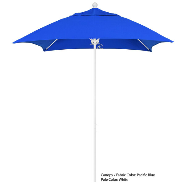 A blue umbrella with a white pole.