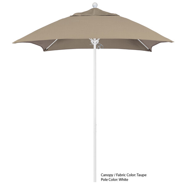 A tan umbrella with a white pole.