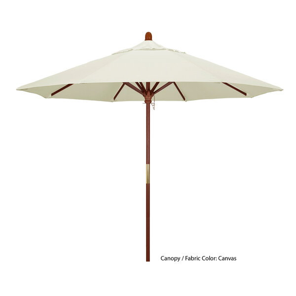 A white California Umbrella with a brown hardwood pole.