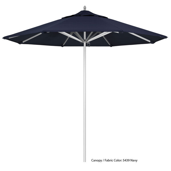 A blue and white California Umbrella with a metal pole.