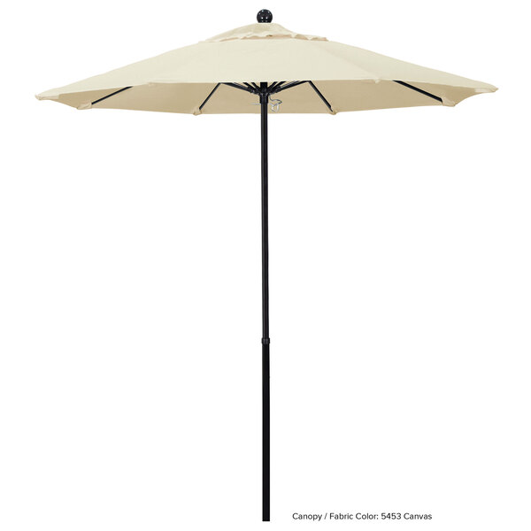 A white California Umbrella with a Sunbrella Oceanside canopy and a black pole.