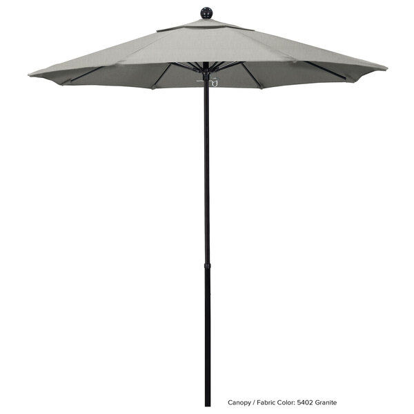 A California Umbrella with a Sunbrella Oceanside canopy on a white pole.