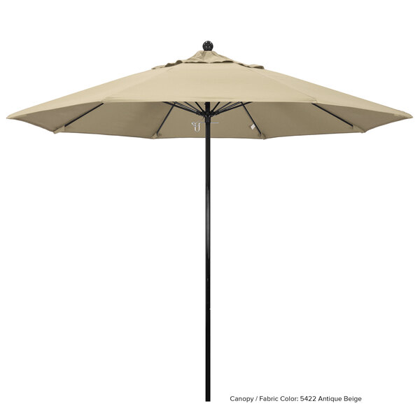 A beige California Umbrella with a black pole.