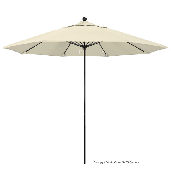 A white umbrella with a black fiberglass pole.