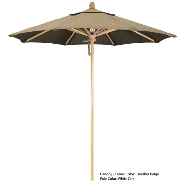 A close-up of a California Umbrella with a tan and black Sunbrella canopy.
