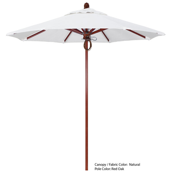 A close up of a California Umbrella with a white Sunbrella canopy and a wooden pole.
