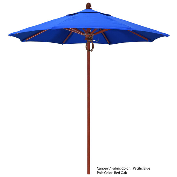 A California Umbrella blue Sunbrella canopy with a wooden pole.