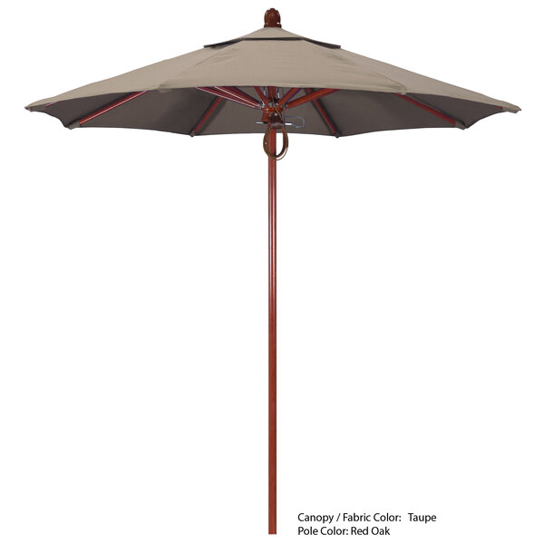 A California Umbrella with a Sunbrella canopy on a fiberglass pole above a table.