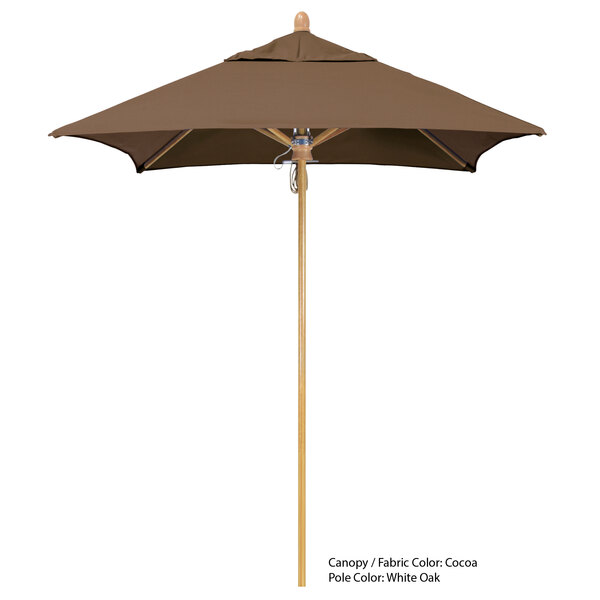 A brown California Umbrella with a wooden pole.