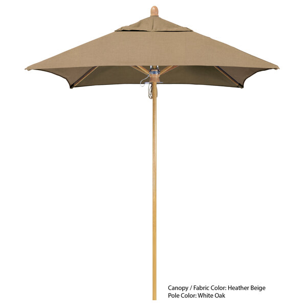 A brown California Umbrella with a Sunbrella tan canopy and wooden pole.